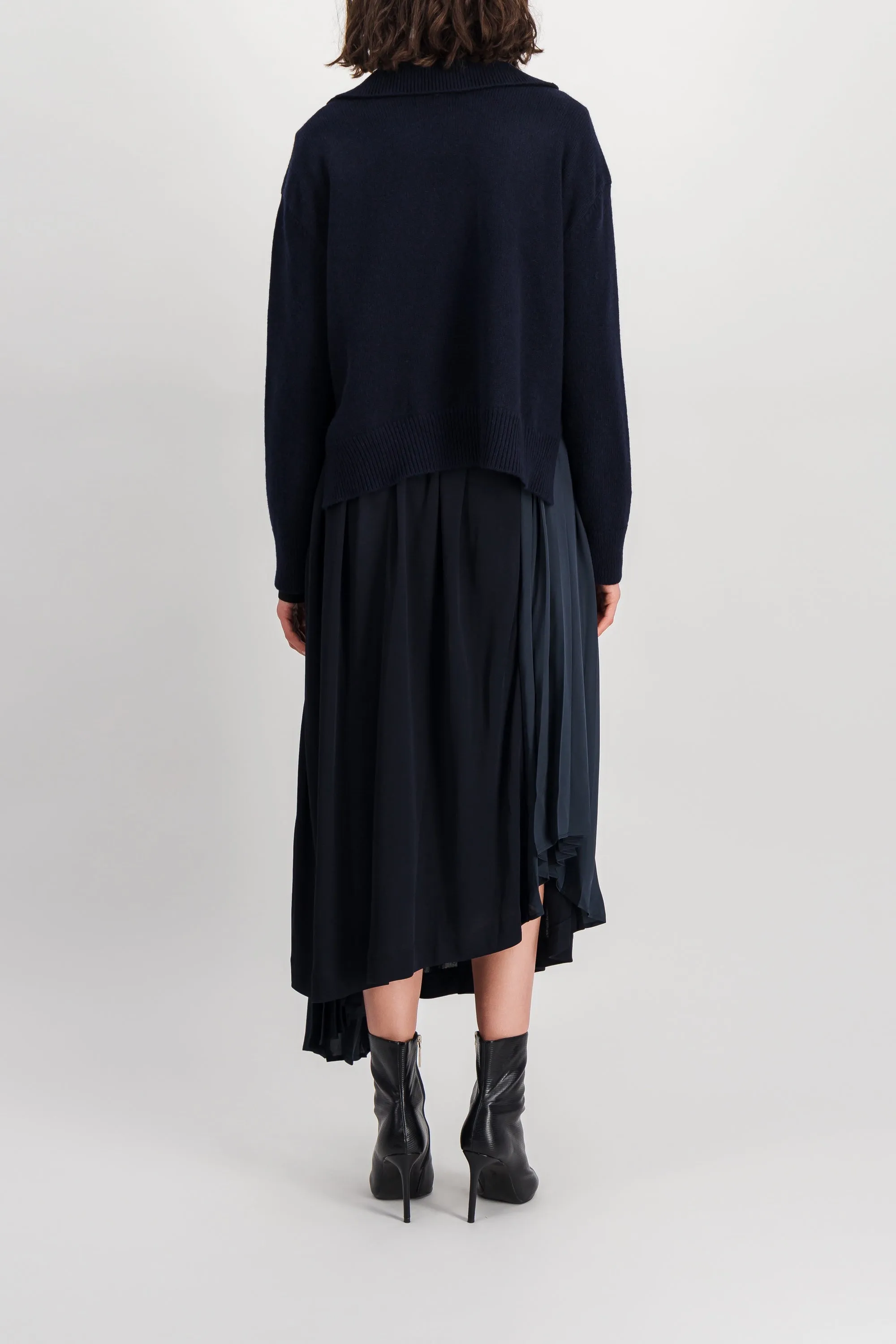 Asymmetric pleated crêpe skirt