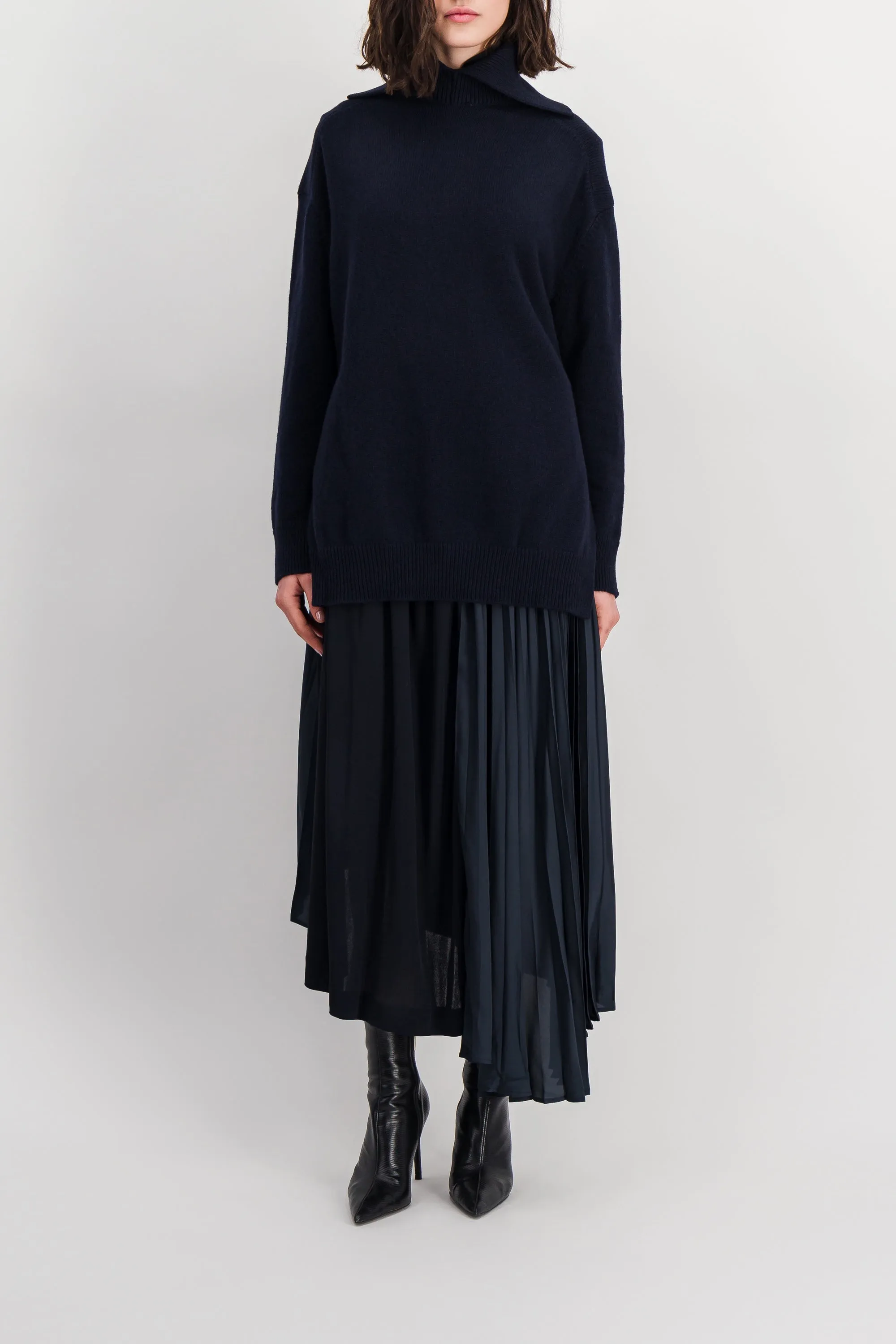 Asymmetric pleated crêpe skirt